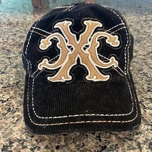 XTREME COUTURE BLACK CORDUROY ADJUSTABLE TRUCKER HAT